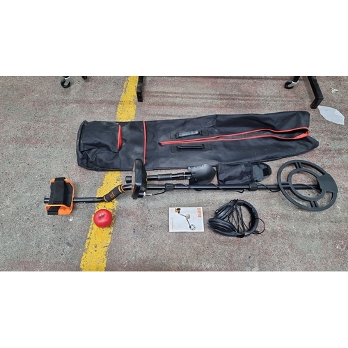 446 - Sunpow GC-1083 Metal Detector includes a carrying bag, headphones, and an owner's manual. Looks as n... 