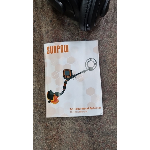 446 - Sunpow GC-1083 Metal Detector includes a carrying bag, headphones, and an owner's manual. Looks as n... 