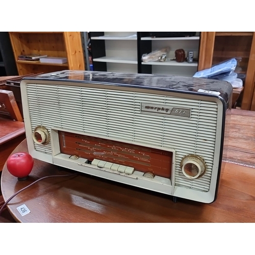 447 - A large Vintage Murphy 674 FM/AM/SW radio features a classic cream and brown Bakelite casing with du... 