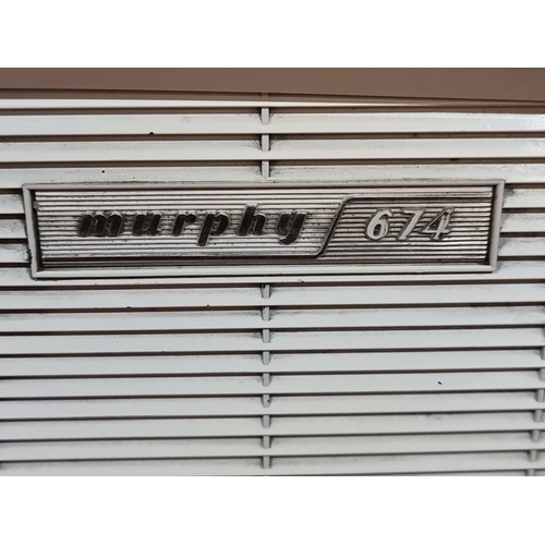 447 - A large Vintage Murphy 674 FM/AM/SW radio features a classic cream and brown Bakelite casing with du... 