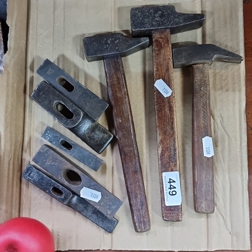 449 - A collection of eight vintage hammers and hammer heads, some stamped Peugeot.