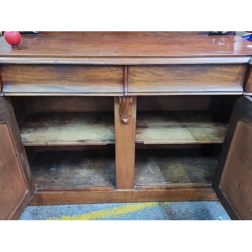 451 - Star lot : A Classic Victorian mahogany sideboard with ornate carved detailing, featuring two drawer... 