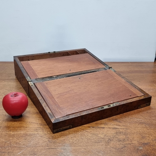 733 - A gorgeous Victorian walnut writing slope featuring brass hardware and cartouche