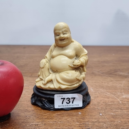 737 - A fantastic characterful Chinese figure of a Buda. Mounted on a wooden plinth base.