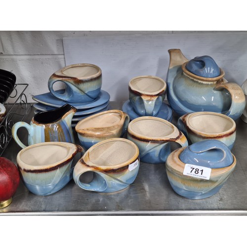 781 - A nice 16 piece pottery tea set including tea pot, cups, saucers, milk jug and lidded sugar bowl.