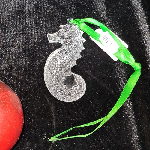 806 - A Waterford Crystal seahorse ornament with green ribbon for hanging. Seen as a symbol of good luck i... 