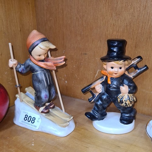 808 - A pair of Goebel West Germany figures including a skier boy and chimney sweeper. Both in good condit... 