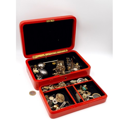 986 - A jewellery box comprising of unchecked costume jewellery.