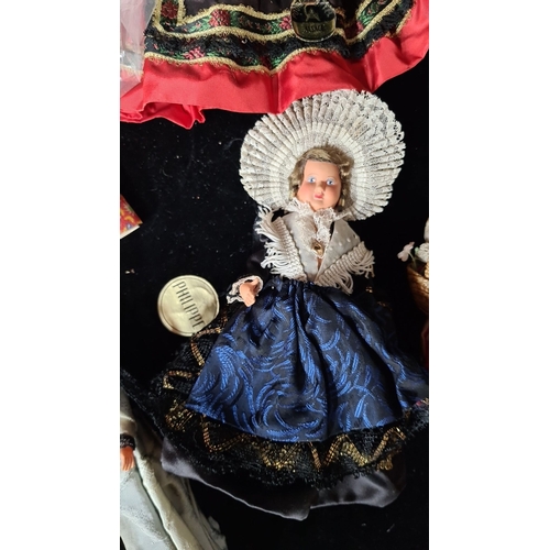 813 - Collection of 20 vintage dolls, including a large polka-dotted doll, two medium-sized Victorian-styl... 