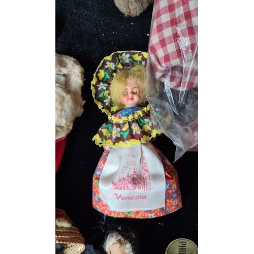 813 - Collection of 20 vintage dolls, including a large polka-dotted doll, two medium-sized Victorian-styl... 