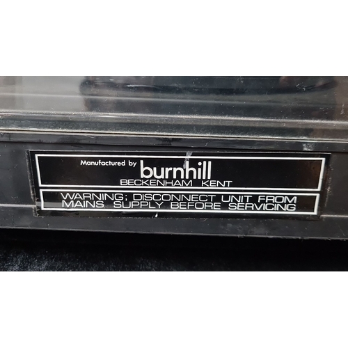 814 - Vintage Burnhill record player with clear dust cover and control knobs. Burnhill logo displayed on f... 