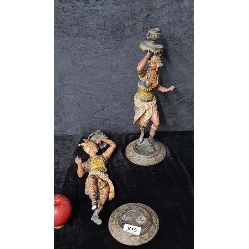 815 - Pair of vintage painted metal sculptures depict traditional dancers, featuring intricate detailing w... 