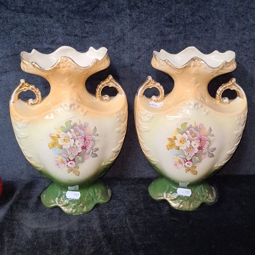 819 - Pair of Victorian porcelain vases with hand-painted pastoral scenes, ornate handles, and scalloped r... 