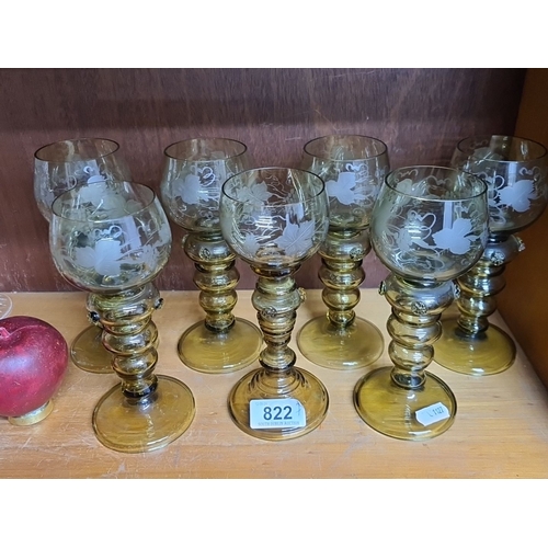 822 - Set of eight vintage etched glass goblets with ornate green glass stems, featuring a floral and grap... 