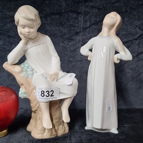 832 - Set of two lladro ceramic figurines depicting children. One child is seated on a log, while the othe... 