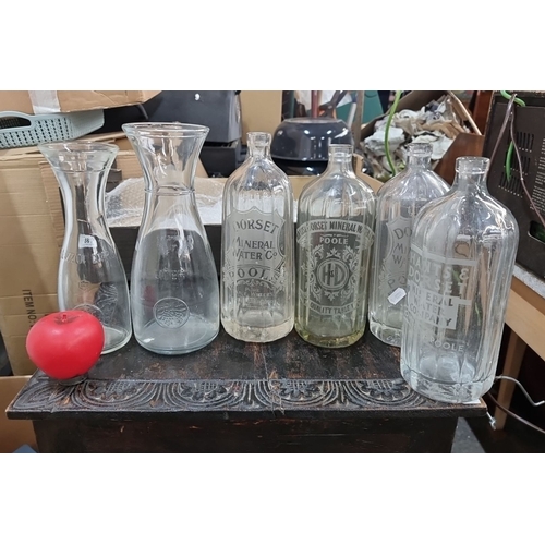 881 - Set of six vintage etched glass bottles, including Dorset Mineral Water Co. and Hants & Dorset Miner... 