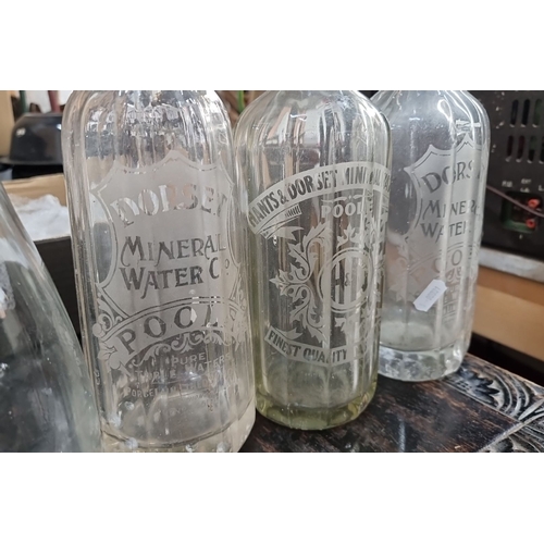 881 - Set of six vintage etched glass bottles, including Dorset Mineral Water Co. and Hants & Dorset Miner... 