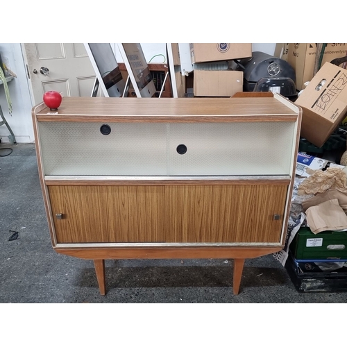 891 - Mid-Century Modern sideboard with sliding glass and wooden doors, featuring adjustable shelving. Mad... 