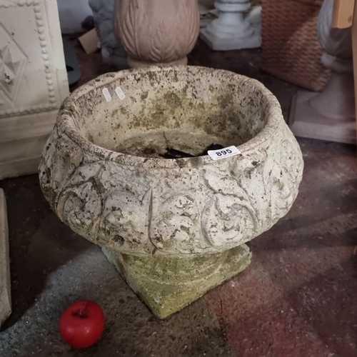 895 - Victorian-style ornamental stone planter with intricate foliage carvings and circular drainage holes... 