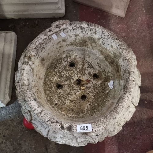 895 - Victorian-style ornamental stone planter with intricate foliage carvings and circular drainage holes... 