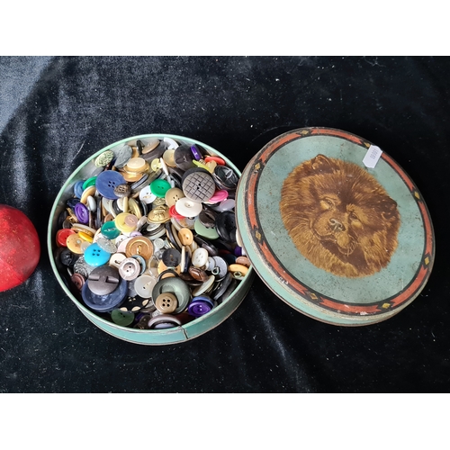 797 - A tin box comprising of a large quantity of vintage buttons.