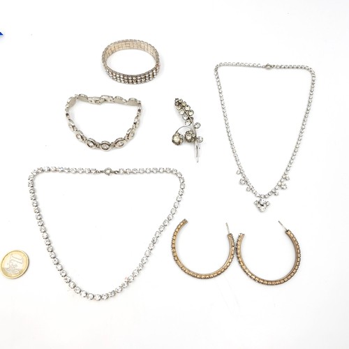 998 - A lot of ladies diamante jewellery including bracelets, hoop earrings, brooch and necklace.