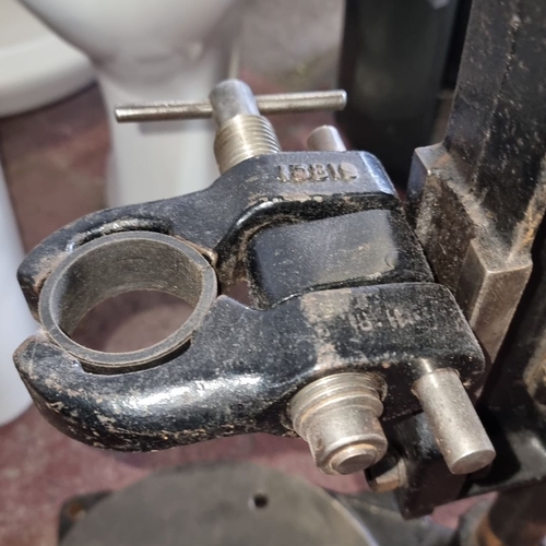 906 - Vintage industrial drill press with cast iron base and lever mechanism, marked 1981.