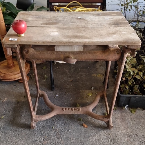 910 - Victorian cast iron and oak mangle by Ewbank features a robust iron frame with distinct manufacturer... 