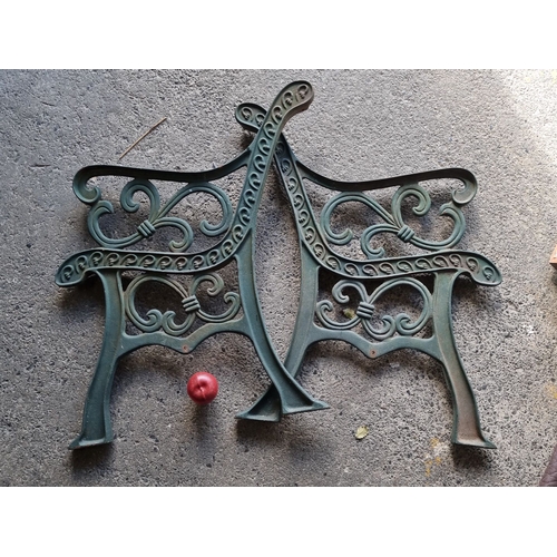 912 - Pair of vintage cast iron bench ends feature ornate scrollwork design.