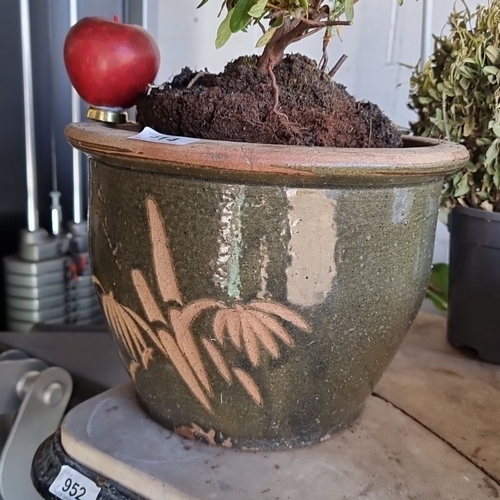 914 - A large terracotta planter with leaf design.