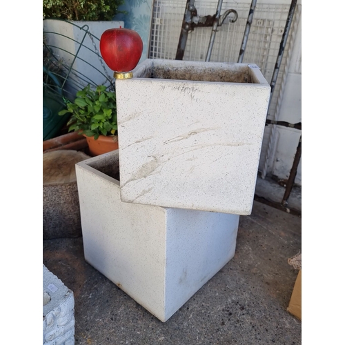 922 - Pair of square white stone planters with natural texture.