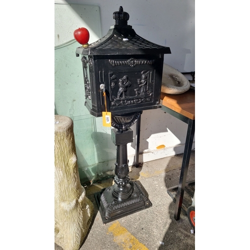 925 - Vintage style cast iron pillar mailbox features intricate relief scenes and a decorative crown top. ... 