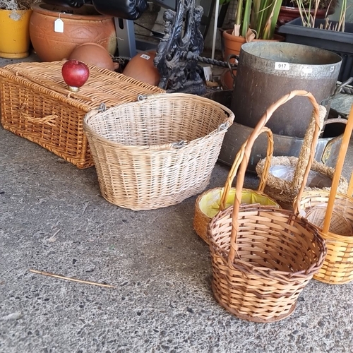 935 - Set of six woven wicker baskets, various shapes and sizes, including one lidded basket.