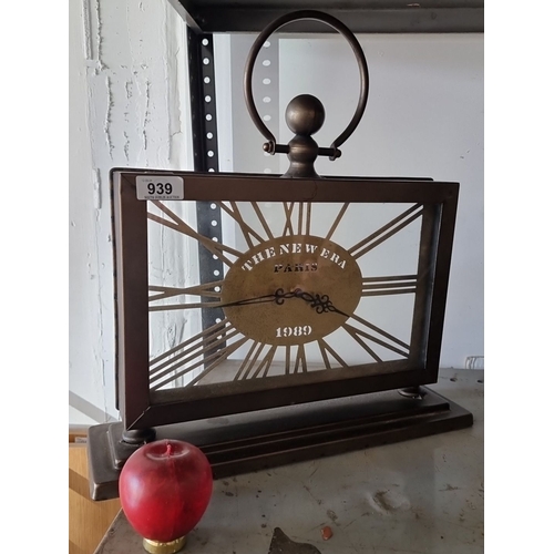 939 - Metallic desk clock, labeled 