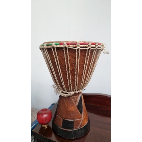 963 - Wooden African djembe drum with rope-tuned head and colorful accents.