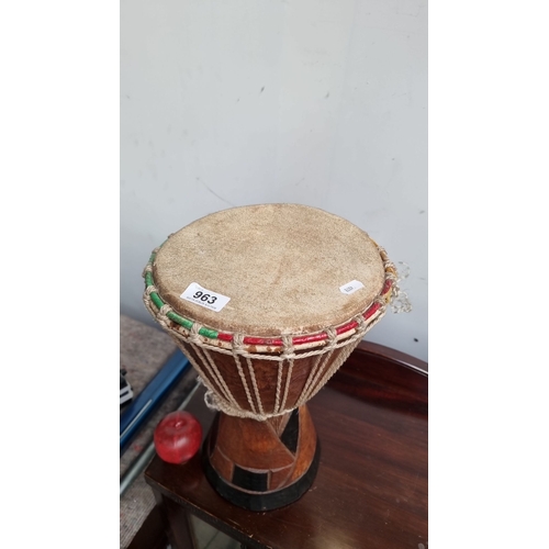 963 - Wooden African djembe drum with rope-tuned head and colorful accents.