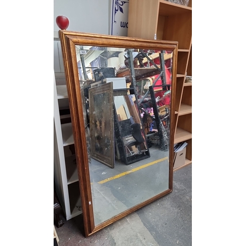 965 - Large rectangular mirror with wooden frame and metal hanging brackets. 
MM: 100 x 150 cm including f... 