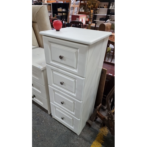 972 - White four-drawer chest with metal knob handles, featuring panelled drawer fronts. heavy, good quali... 