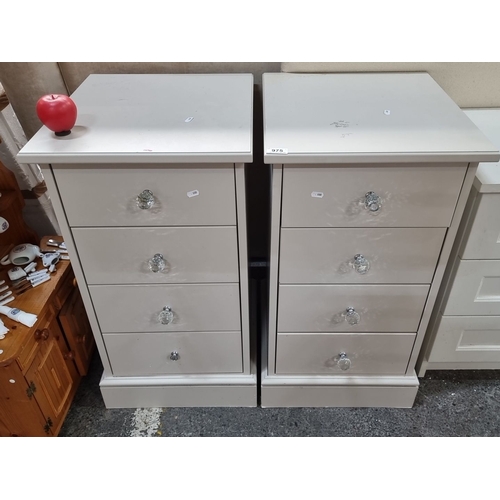 975 - Pair of contemporary four-drawer bedside chests in cream finish with decorative glass knobs. Each ch... 