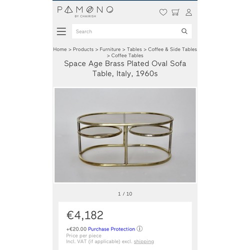 642 - Super Star Lot : A vintage 1960s Italian  signature brass plated oval Sofa table. Features revolving... 