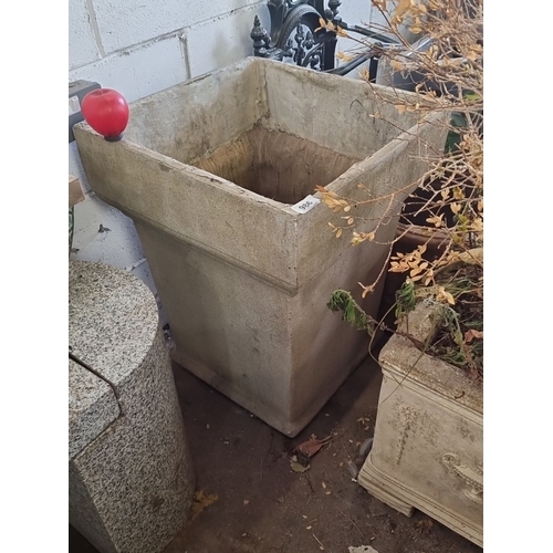 1095 - Large rectangular concrete planter with a weathered finish. Dimensions are approximately 2 feet tall... 