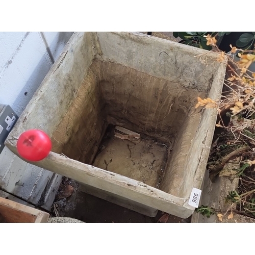 1095 - Large rectangular concrete planter with a weathered finish. Dimensions are approximately 2 feet tall... 