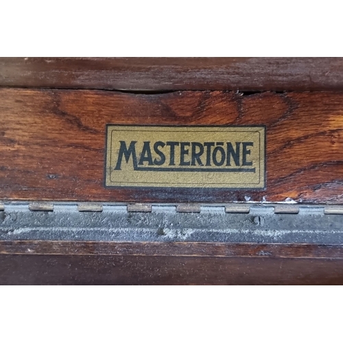 1096 - Early 20th Century Mastertone Gramophone in oak cabinet, featuring a hand-crank turntable and intern... 