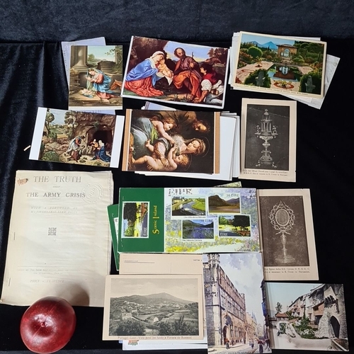 1101 - Mixed lot containing vintage postcards, stamps, and an old issue of 