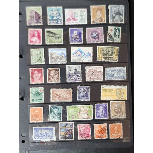 1102 - A wonderful folder containing a collection of stamps from around the World including Kenya, Spain, I... 