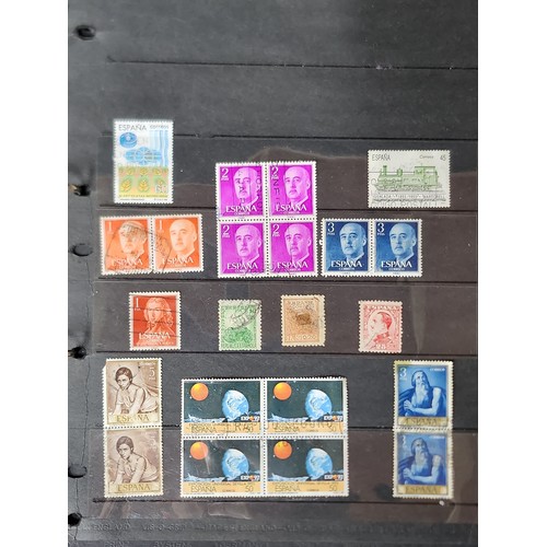 1102 - A wonderful folder containing a collection of stamps from around the World including Kenya, Spain, I... 