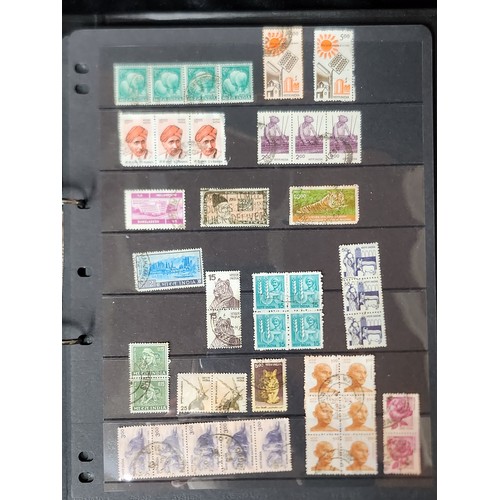 1102 - A wonderful folder containing a collection of stamps from around the World including Kenya, Spain, I... 