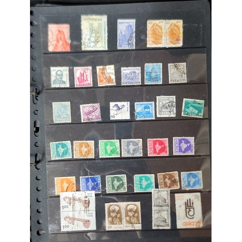 1102 - A wonderful folder containing a collection of stamps from around the World including Kenya, Spain, I... 