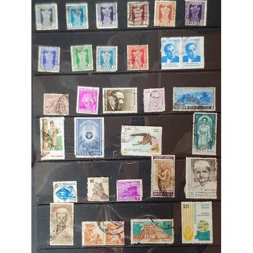 1102 - A wonderful folder containing a collection of stamps from around the World including Kenya, Spain, I... 