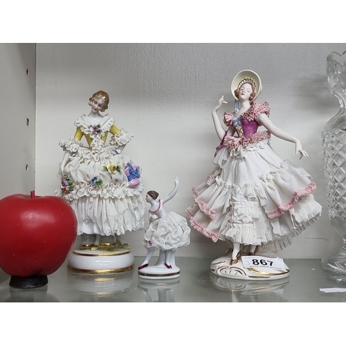 1104 - Set of three porcelain figurines, including two Dresden lace ladies and a ballerina. Marked 